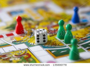 stock-photo-colorful-play-figures-with-dice-on-board-135000779